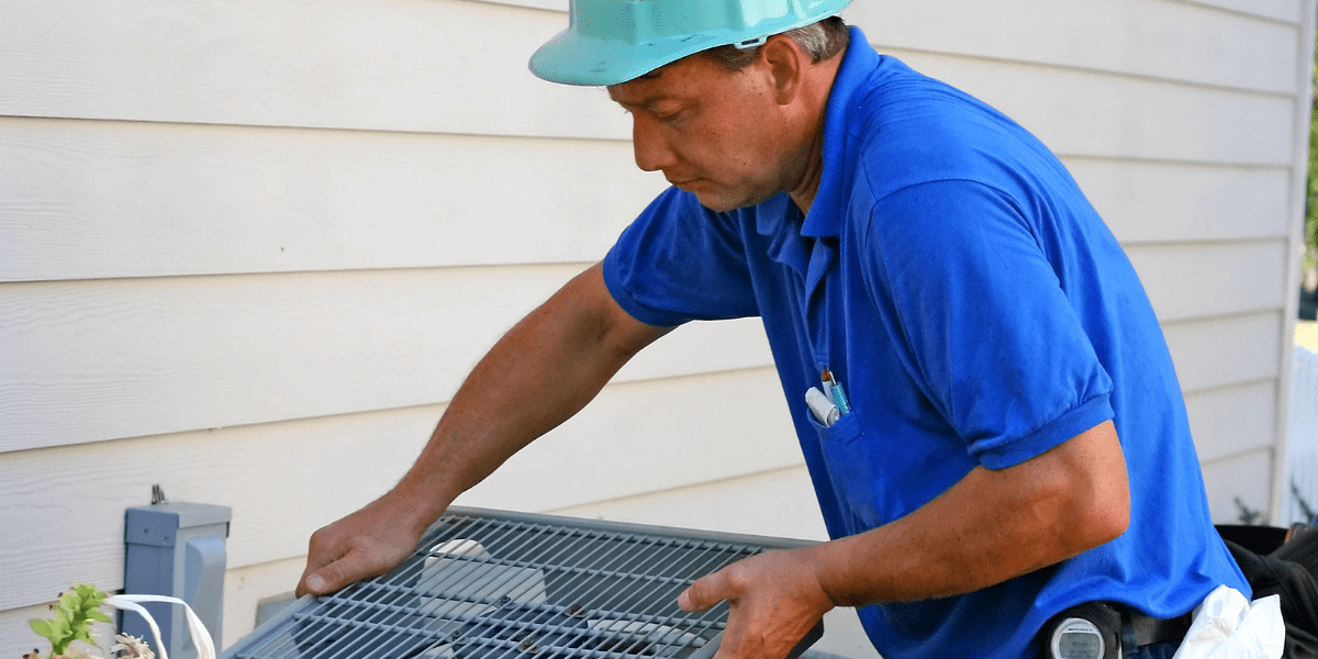 hvac tech doing Air Conditioner Coil Replacement