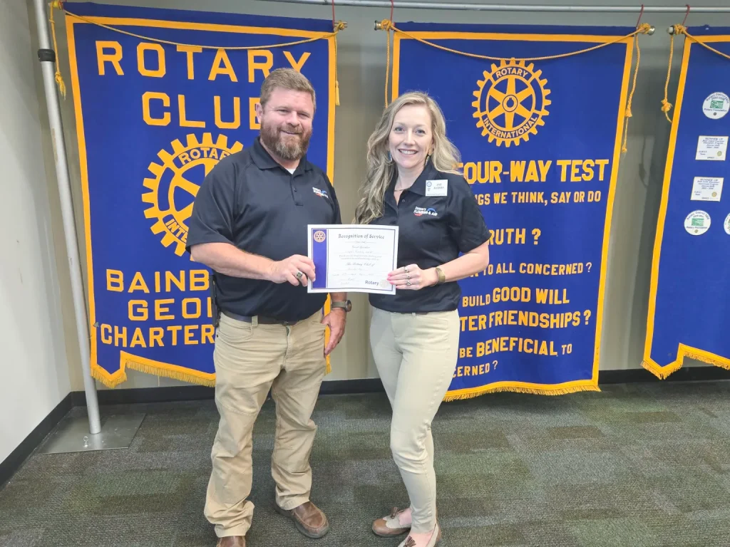 Employees of Cooper’s Plumbing & Air address Rotary